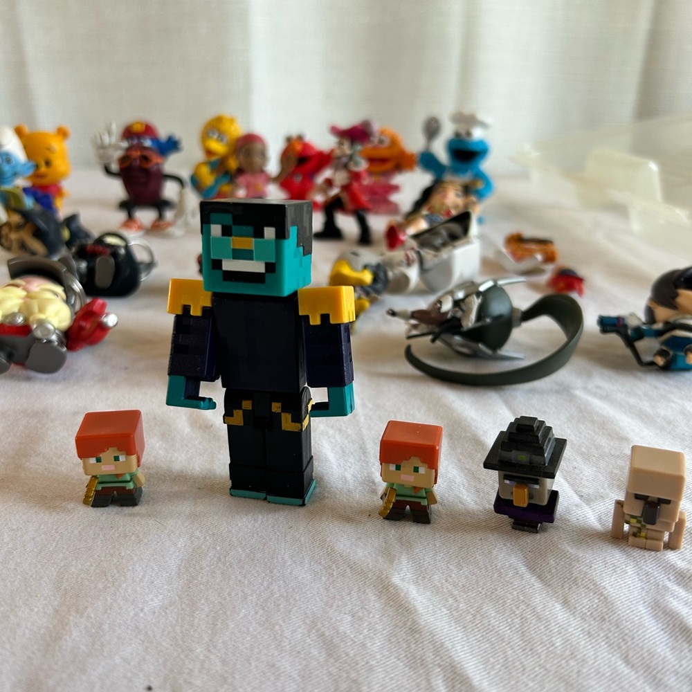Big lot of kids toys some vintage . Including Smurf’s/Overwatch/Minecraft/Disney